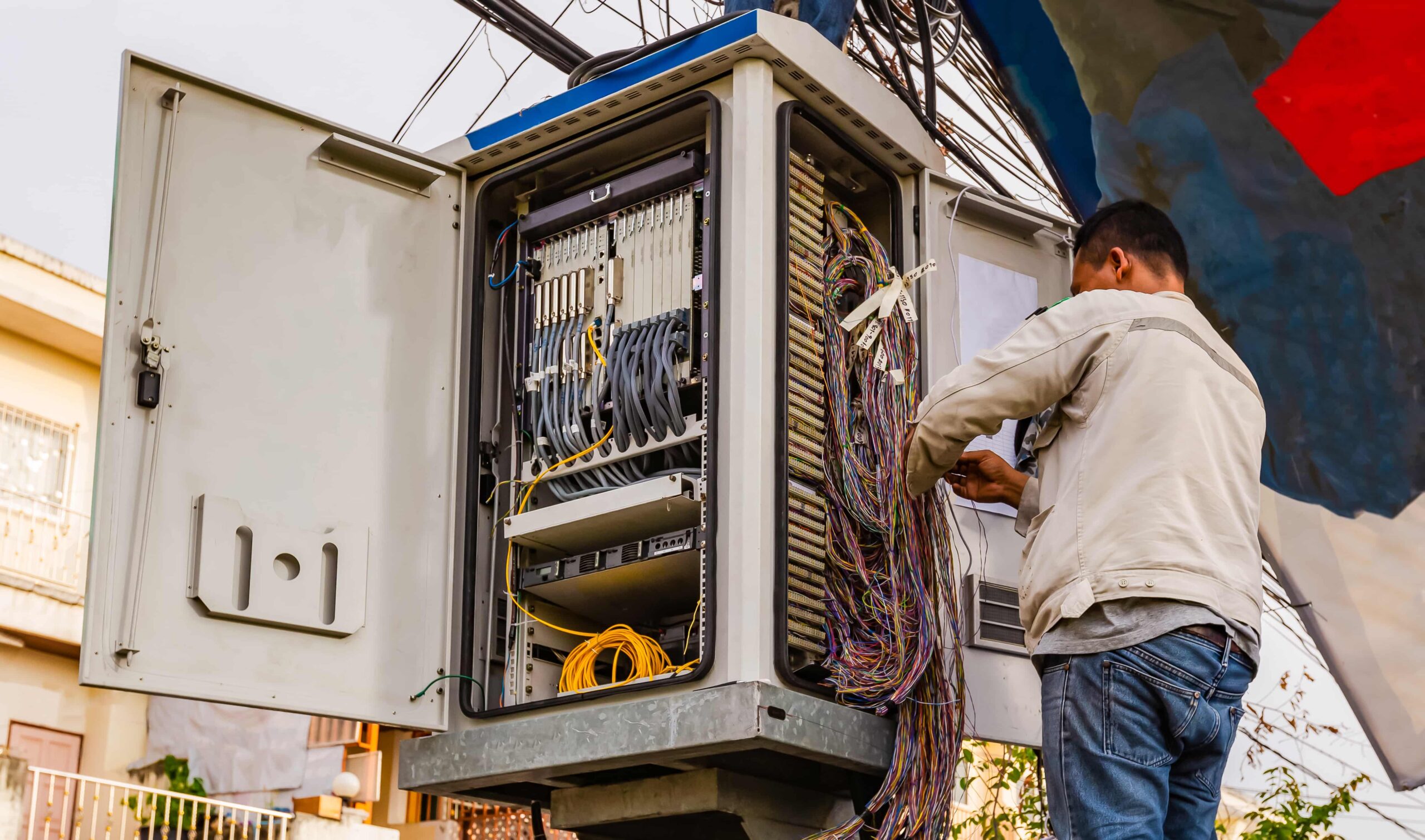 telephone technician checks coaxial cable